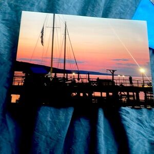 The pier at sunset with the true love schooner dock